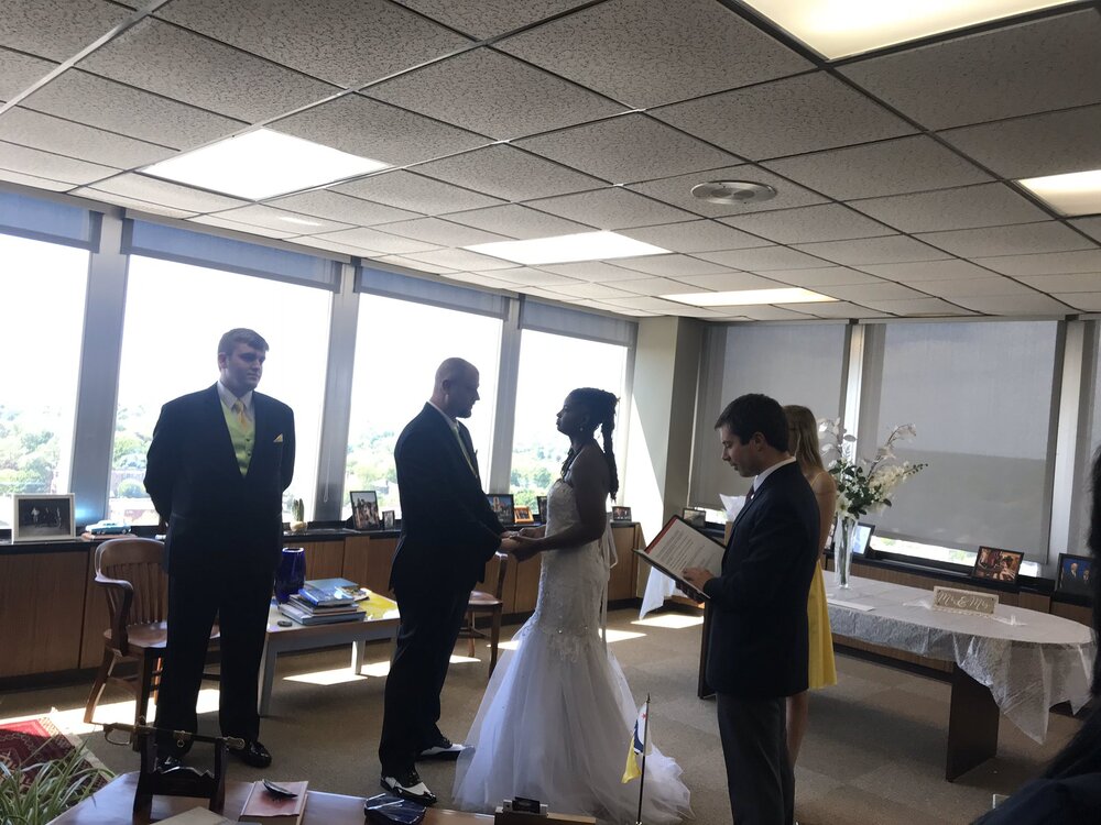  Performing one of many wedding ceremonies in the mayor’s office. Posted by Laura O’Sullivan. 